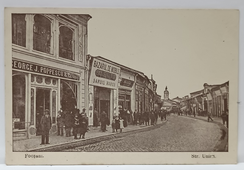 FOCSANI , STRADA UNIRII , IN PLAN APROPIAT MAGAZINUL ' GEORGE J. POPPESCU  '  SI BAZARUL; DE MOBILE SAMUIL MARCU , CARTE POSTALA , INTERBELICA