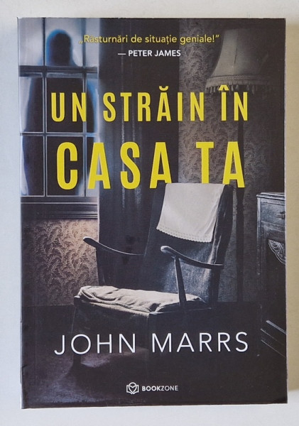 UN STRAIN IN CASA TA , roman de JOHN MARRS , 2025